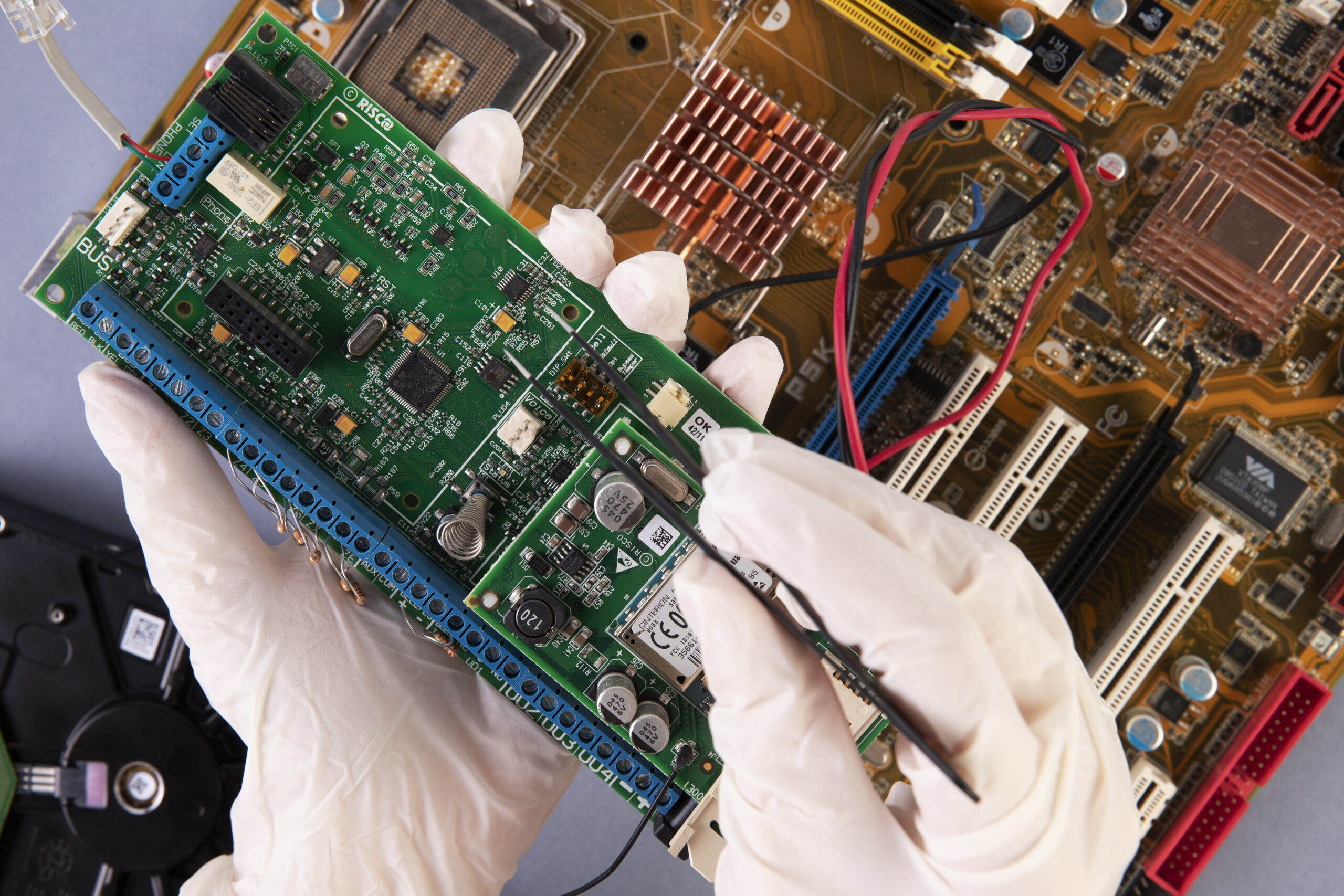 close-up-hands-holding-hardware-components